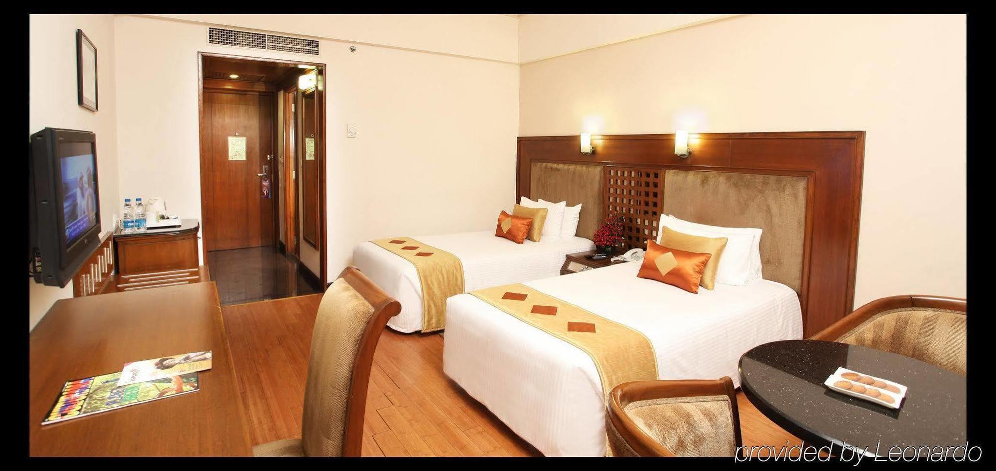 Greenpark Madrás Habitación foto A room at the hotel